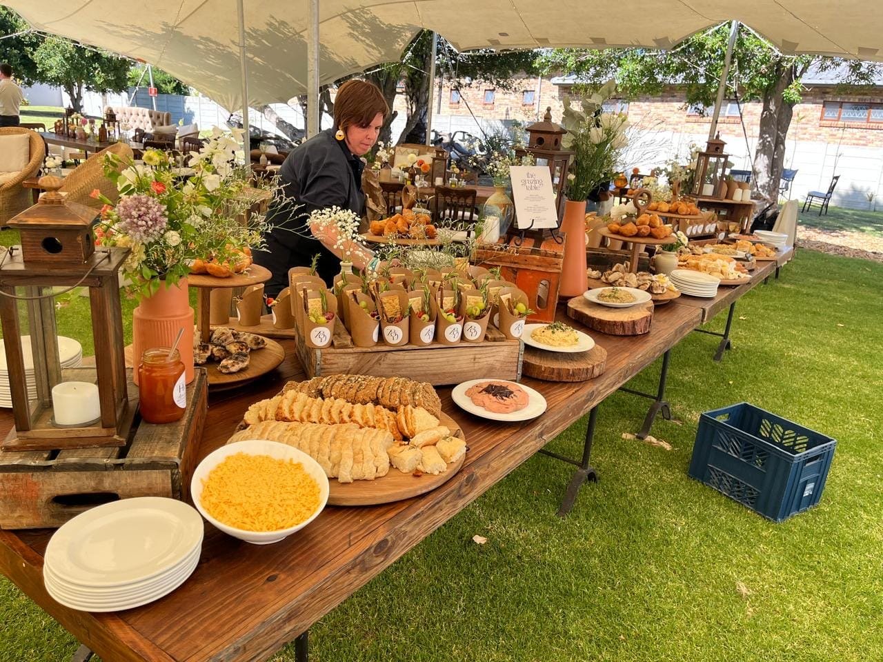 A long grazing table laid out down the length of the tent