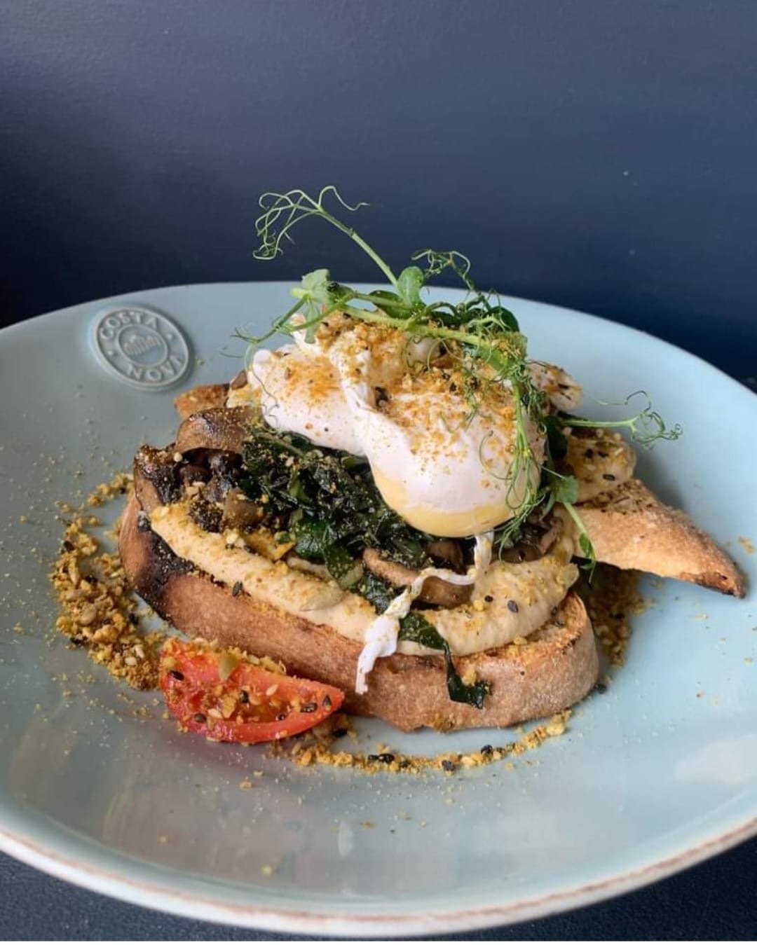 Miso mushrooms and cottage cheese on sourdough, topped with a poached egg