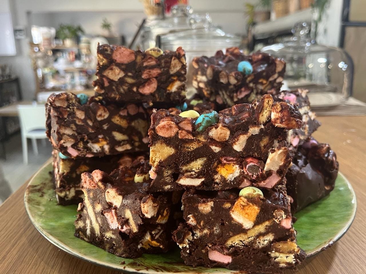 Thick slabs of rocky road on a green plate